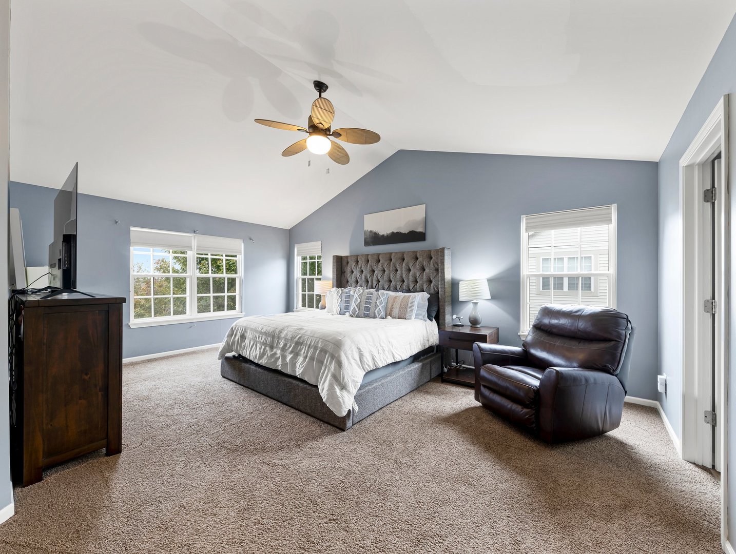 26305 Mapleview Drive Plainfield, IL 60585 - Photo 19 of 40 a spacious bedroom with a bed a couch and a window