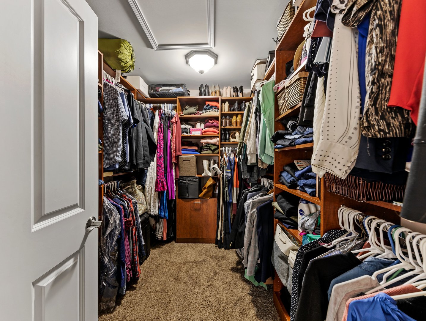 26305 Mapleview Drive Plainfield, IL 60585 - Photo 21 of 40 a view of walk in closet with clothes and shoes