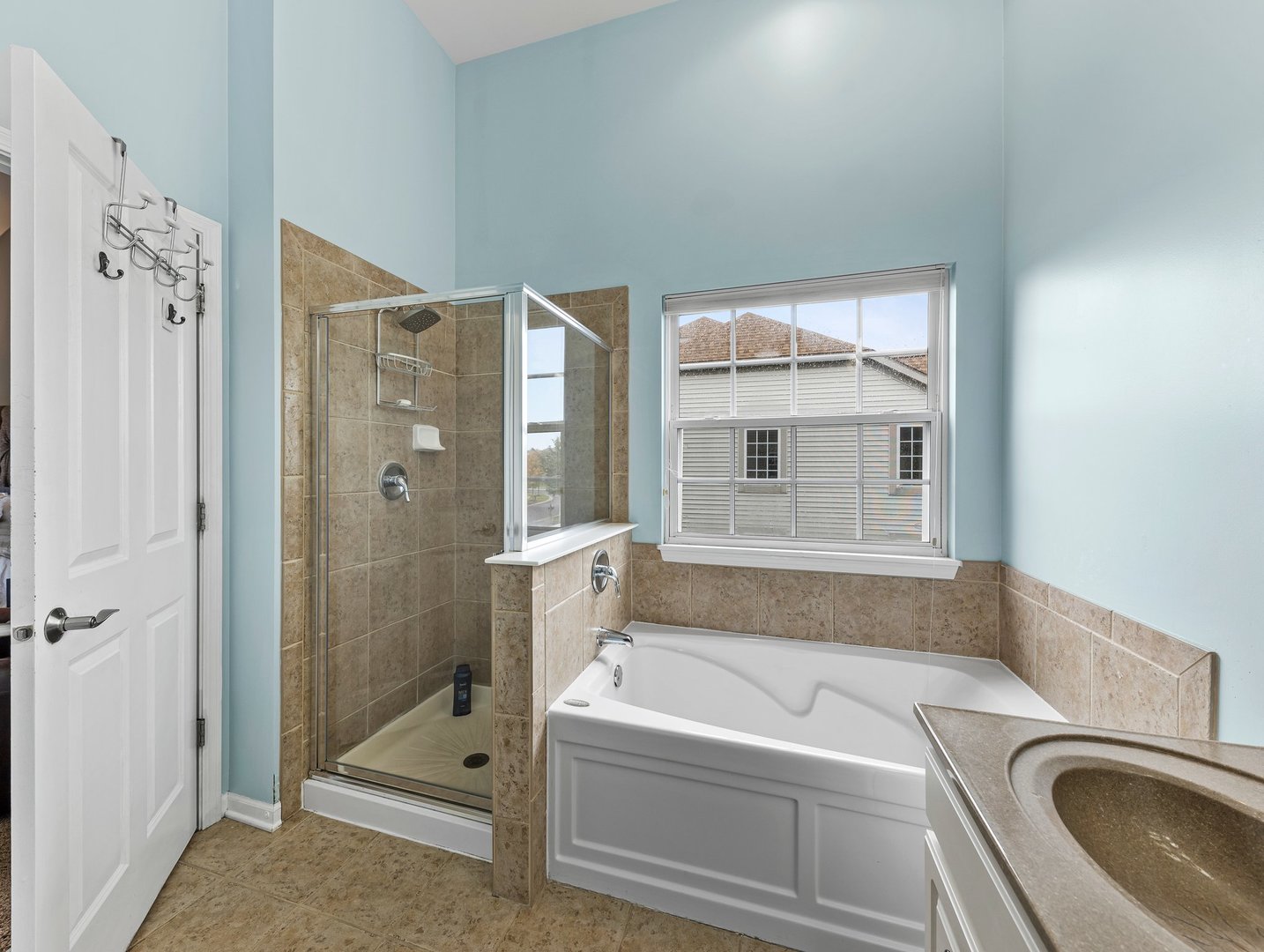 26305 Mapleview Drive Plainfield, IL 60585 - Photo 22 of 40 a bathroom with a tub a sink and a shower