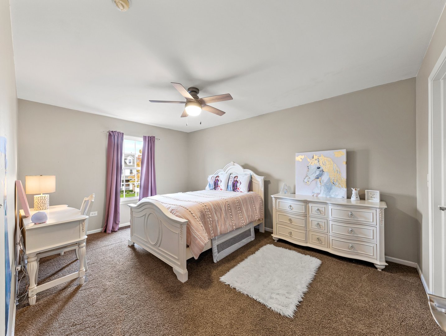 26305 Mapleview Drive Plainfield, IL 60585 - Photo 26 of 40 a spacious bedroom with a bed and a chandelier