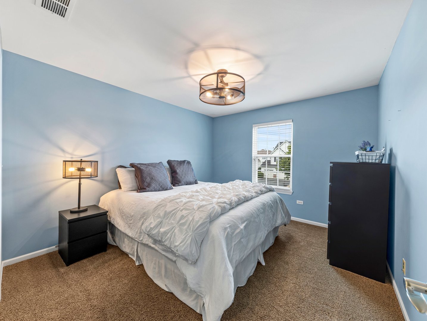 26305 Mapleview Drive Plainfield, IL 60585 - Photo 28 of 40 a bedroom with bed and window