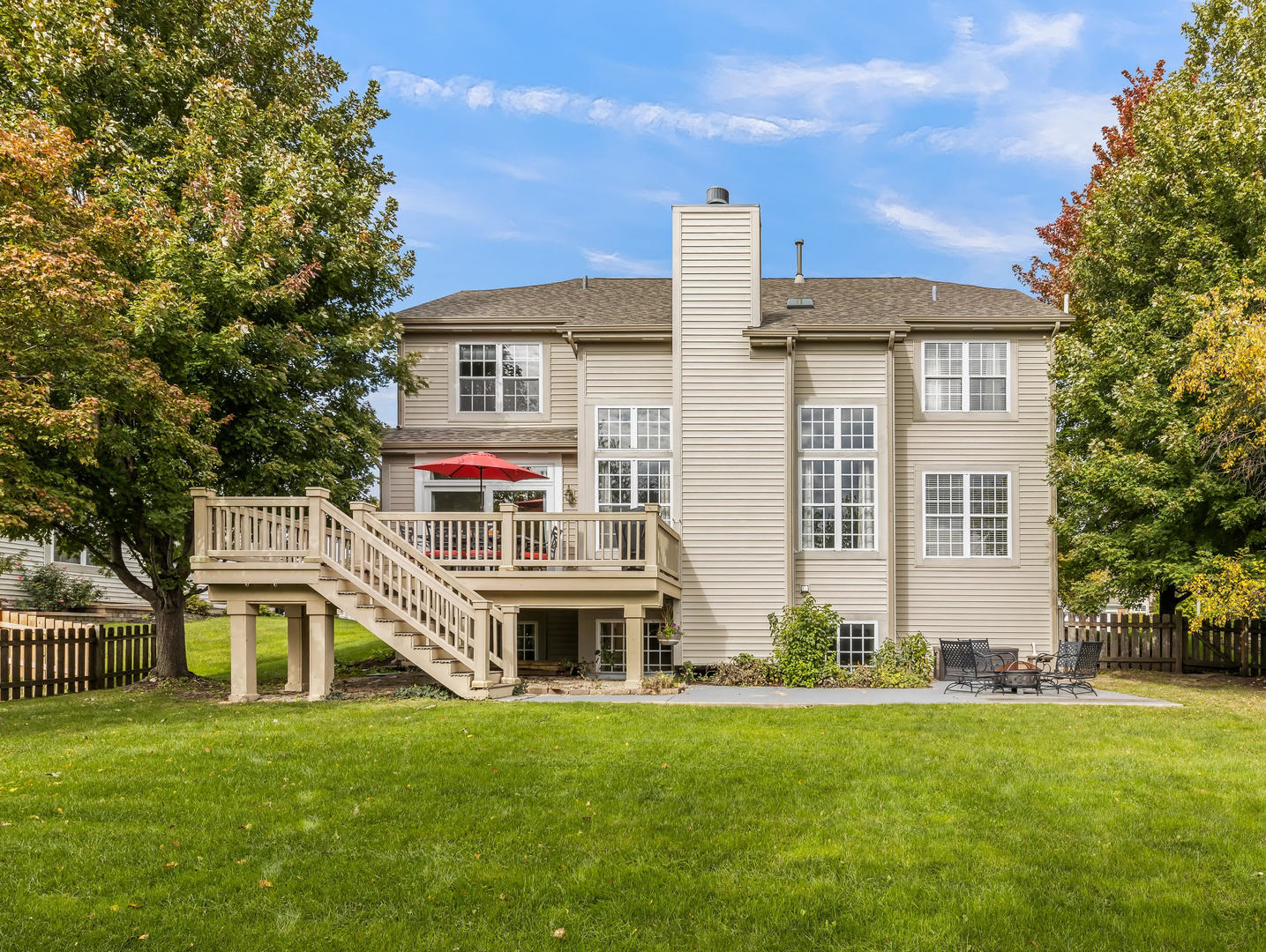26305 Mapleview Drive Plainfield, IL 60585 - Photo 38 of 40 a front view of a house with a garden and plants