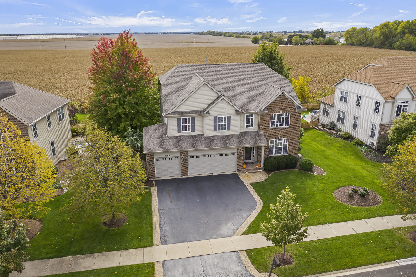 26305 Mapleview Drive Plainfield, IL 60585 - Photo 4 of 40 an aerial view of a house with a garden and lake view