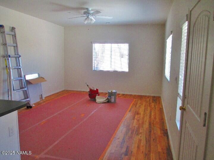 108 East Terrace Avenue, Unit 2 Flagstaff, AZ 86001 - Photo 3 of 8 a bedroom with a bed and a chandelier