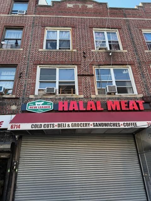 6714 5th Avenue Brooklyn, NY 11220 - Photo 1 of 1 a view of a house with a balcony