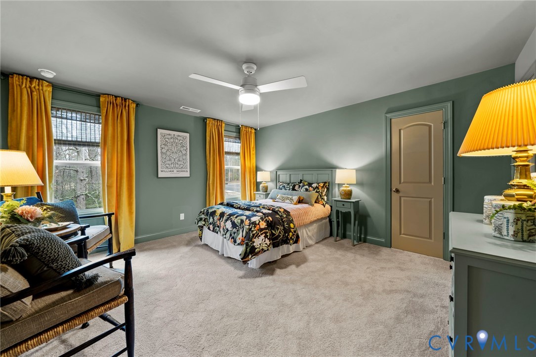 Lot 33 Tuckmar Ridge Drive Moseley, VA 23120 - Photo 13 of 21 a spacious bedroom with a bed and wooden floor