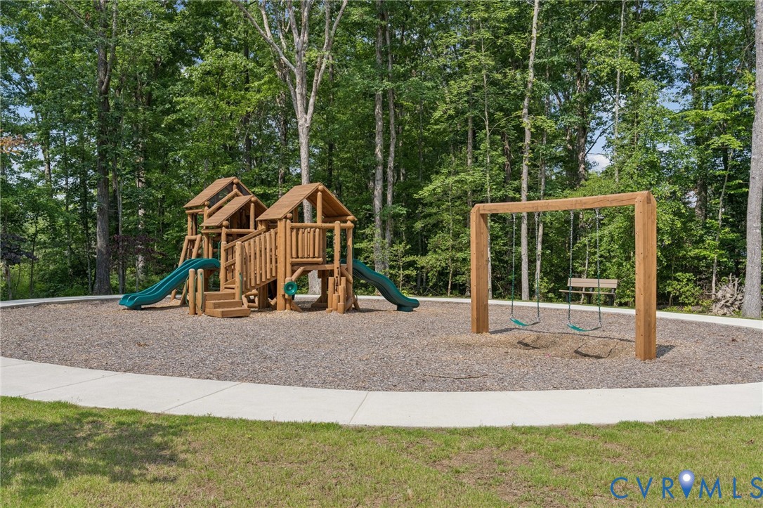 Lot 33 Tuckmar Ridge Drive Moseley, VA 23120 - Photo 20 of 21 a view of a house with backyard and deck
