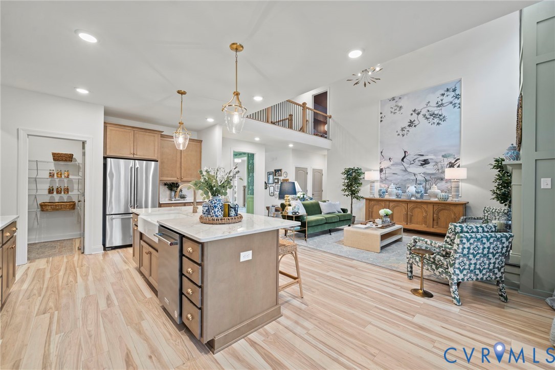 Lot 33 Tuckmar Ridge Drive Moseley, VA 23120 - Photo 9 of 21 a living room with furniture a table and kitchen view