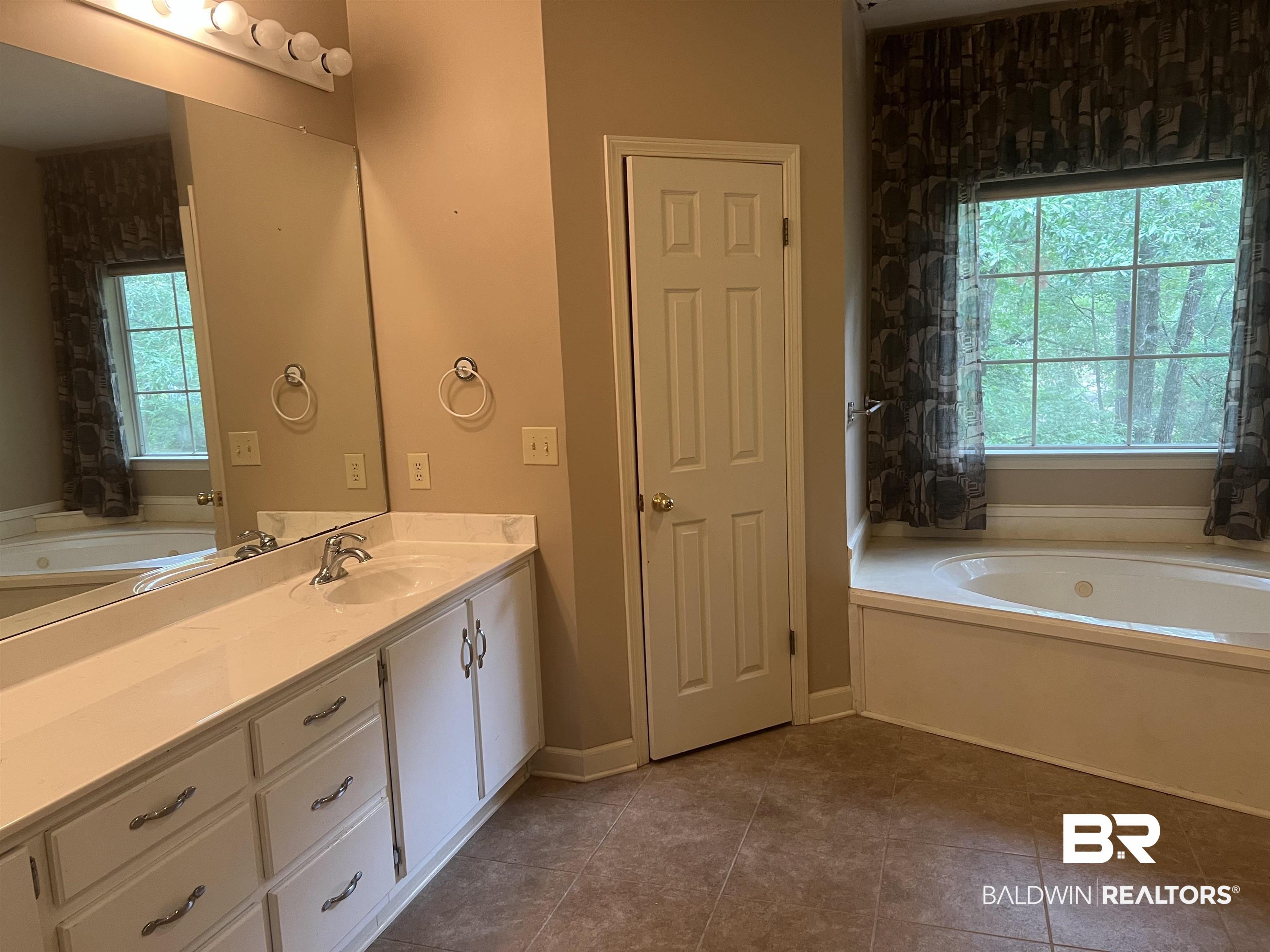 295 Norwood Road Monroeville, AL 36460 - Photo 10 of 32 Full bath with a bath, vanity, and tile patterned flooring