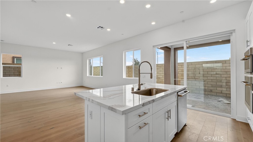 224 Lily Loop Irvine, CA 92618 - Photo 17 of 39 a kitchen with sink and cabinets