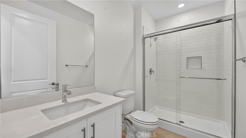 224 Lily Loop Irvine, CA 92618 - Photo 20 of 39 a bathroom with a sink toilet and shower