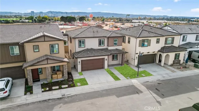 an aerial view of a house with a garden