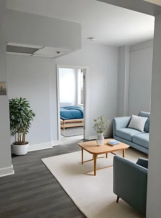 a living room with furniture and a potted plant