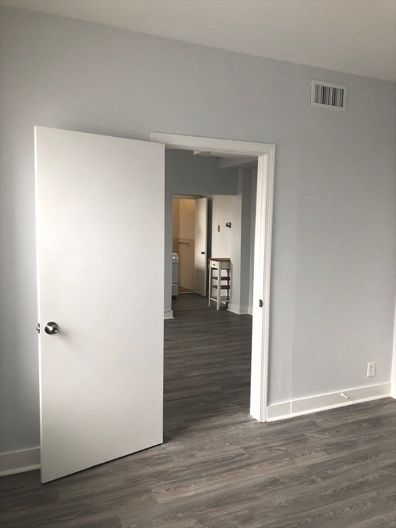 475 Commonwealth Avenue, Unit 704 Boston, MA 02215 - Photo 3 of 11 a view of a hallway with wooden floor