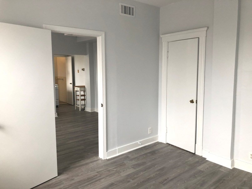 475 Commonwealth Avenue, Unit 704 Boston, MA 02215 - Photo 4 of 11 a view of a hallway with wooden floor