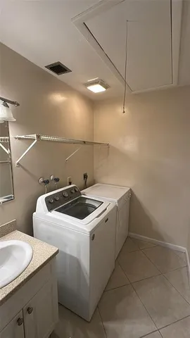 a utility room with dryer and washer