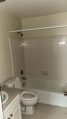 a bathroom with a sink a toilet and a bathtub