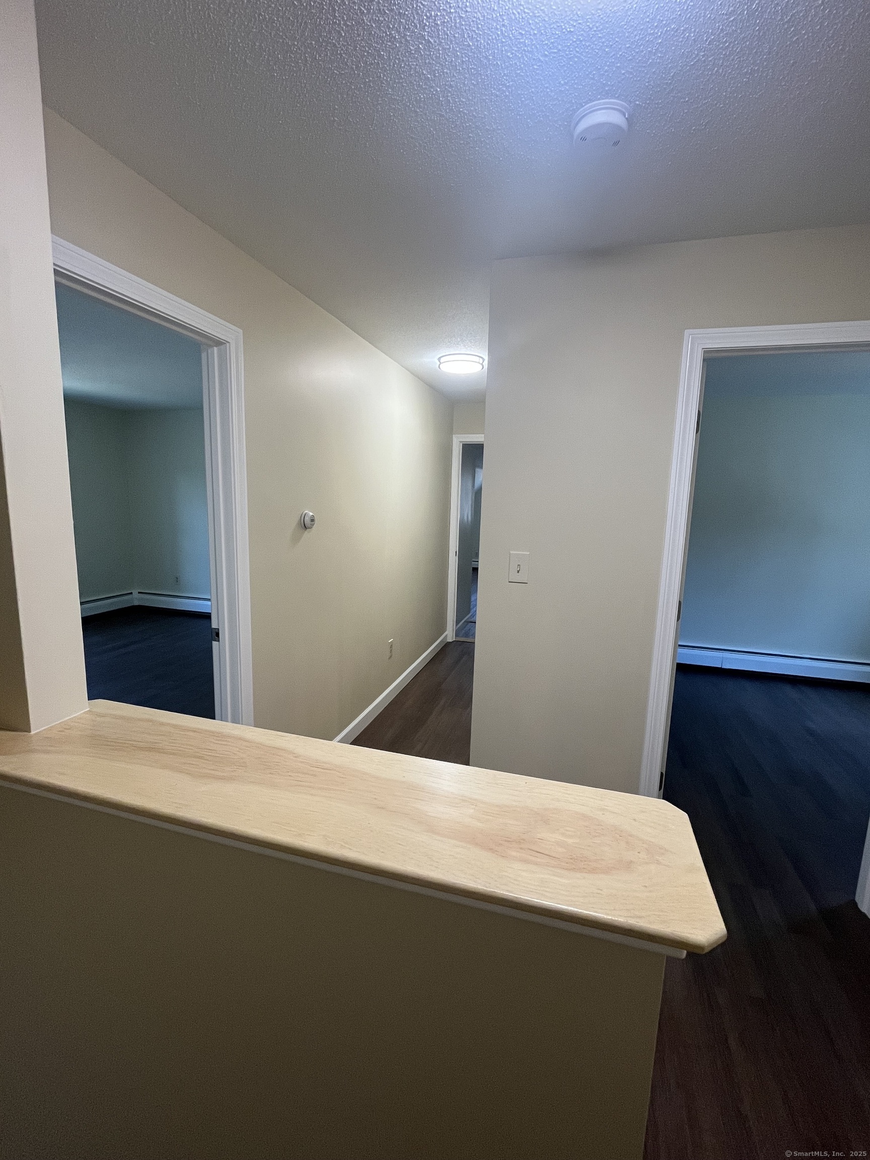 61 Arch Street, Unit 1 Burlington, CT 06013 - Photo 14 of 22 a bedroom with a bed and a mirror