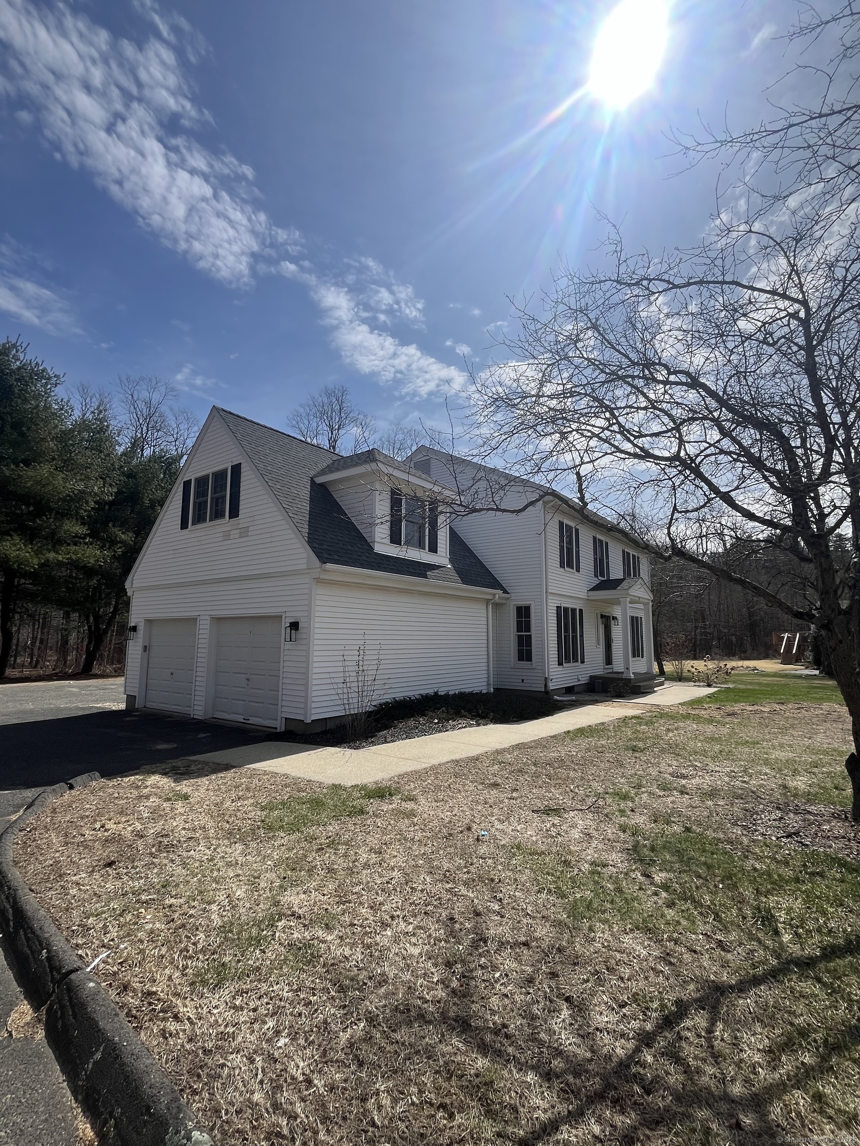 61 Arch Street, Unit 1 Burlington, CT 06013 - Photo 2 of 22 a house view with a garden space