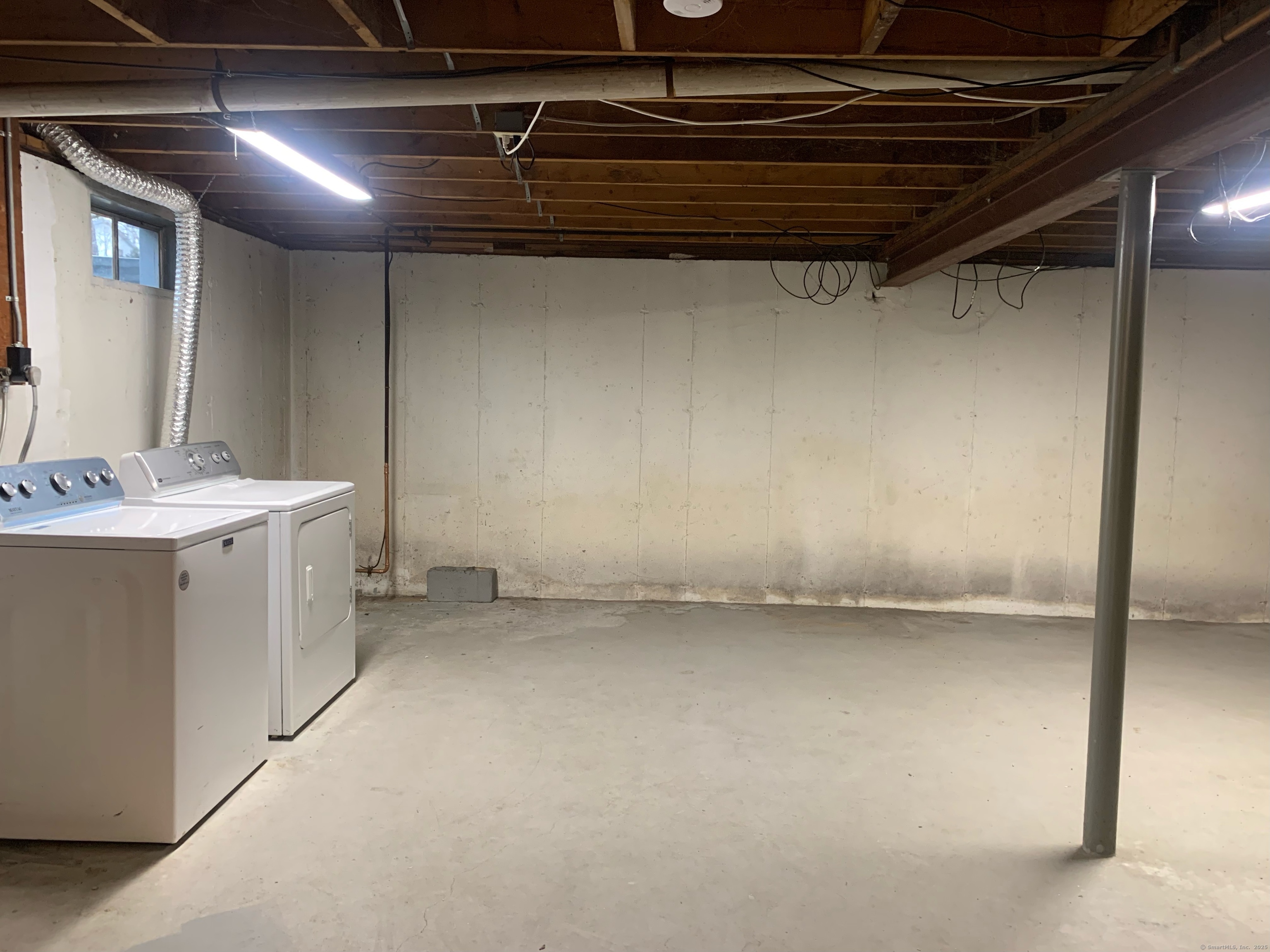 61 Arch Street, Unit 1 Burlington, CT 06013 - Photo 21 of 22 a utility room with dryer and washer