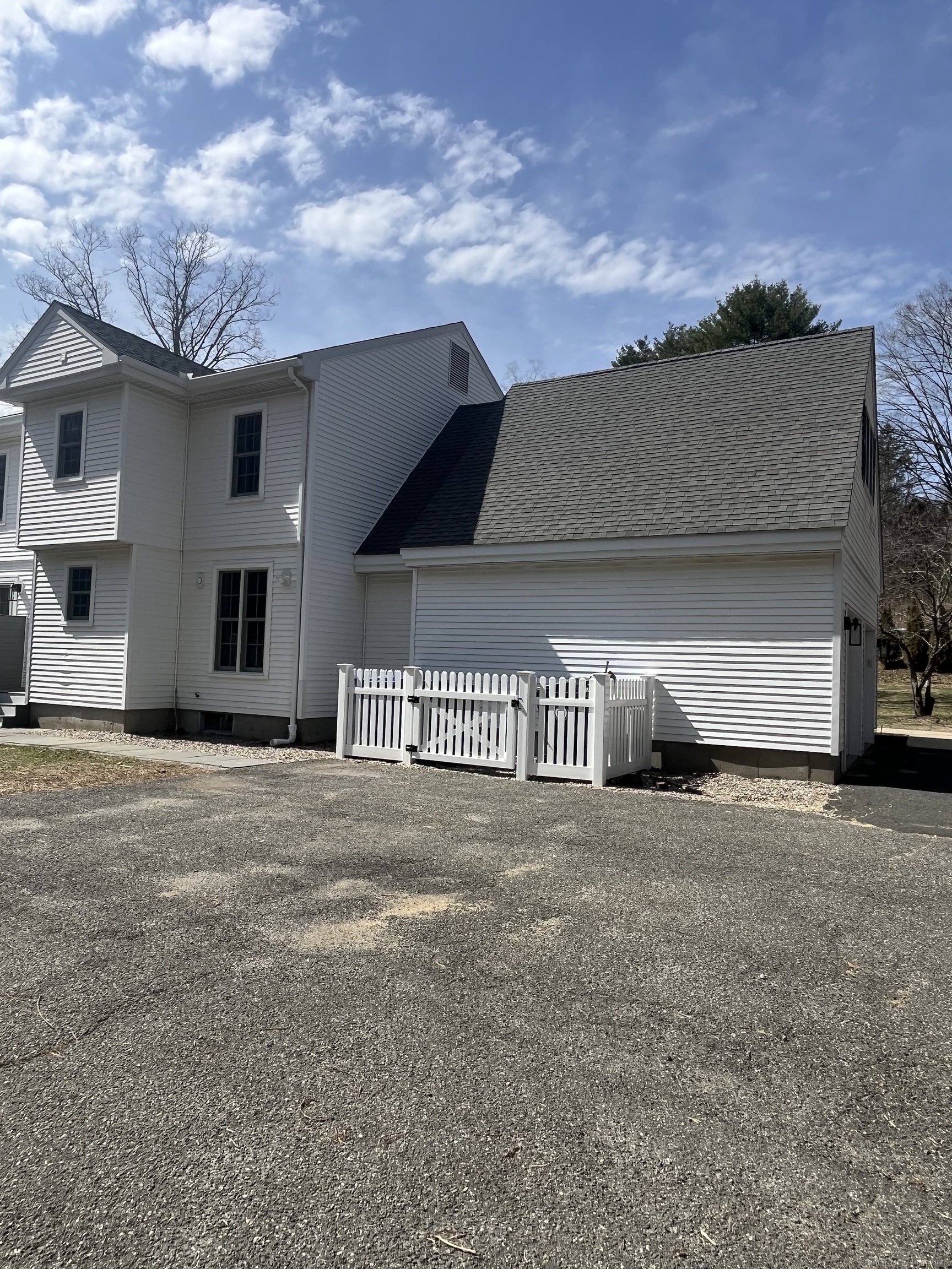 61 Arch Street, Unit 1 Burlington, CT 06013 - Photo 3 of 22 a front view of a house with a garage