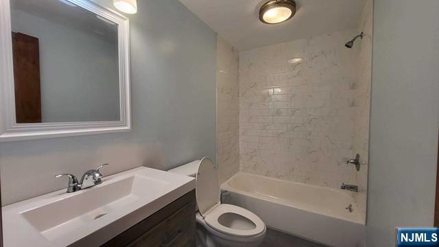 47 Hackensack Avenue Ridgefield Park, NJ 07660 - Photo 13 of 36 a bathroom with a sink and a mirror
