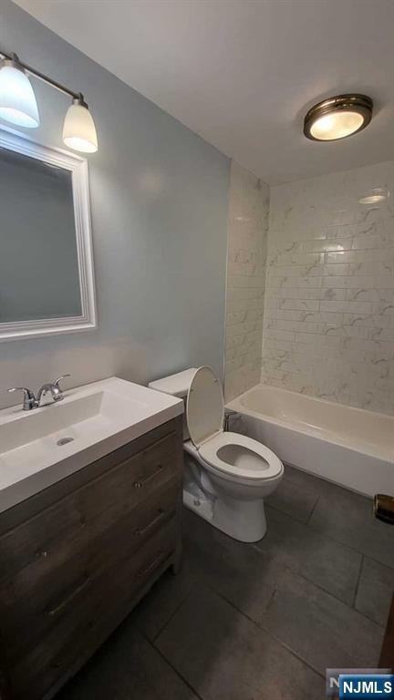 47 Hackensack Avenue Ridgefield Park, NJ 07660 - Photo 14 of 36 a bathroom with a toilet a sink and bathtub