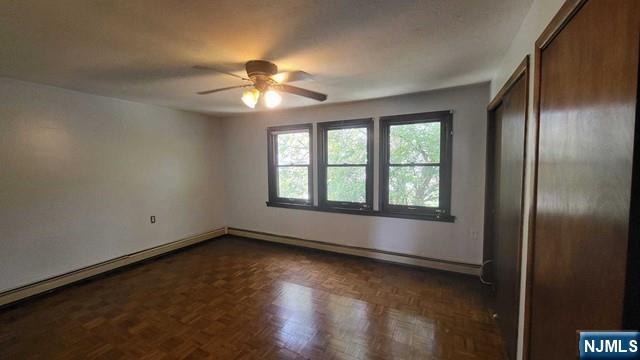 47 Hackensack Avenue Ridgefield Park, NJ 07660 - Photo 19 of 36 an empty room with chandelier fan and windows