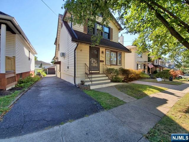 47 Hackensack Avenue Ridgefield Park, NJ 07660 - Photo 2 of 36 a front view of a house with a yard