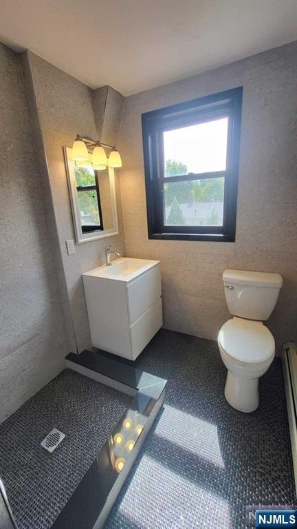 47 Hackensack Avenue Ridgefield Park, NJ 07660 - Photo 21 of 36 a bathroom with a sink toilet and mirror
