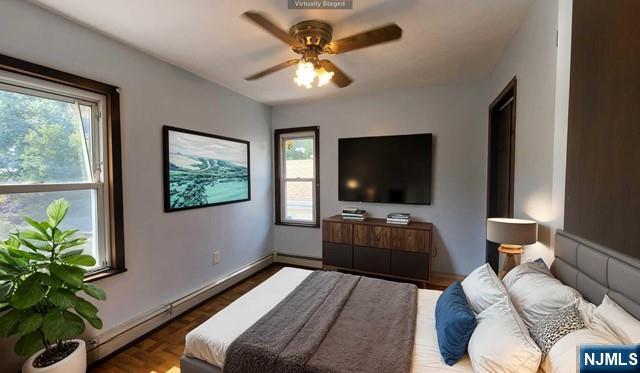 47 Hackensack Avenue Ridgefield Park, NJ 07660 - Photo 24 of 36 a living room with furniture and a flat screen tv