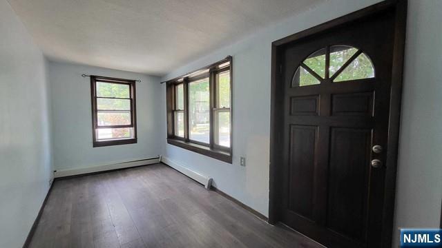 47 Hackensack Avenue Ridgefield Park, NJ 07660 - Photo 3 of 36 a view of an empty room with wooden floor and a window