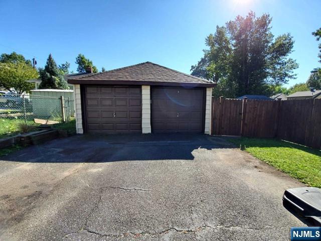 47 Hackensack Avenue Ridgefield Park, NJ 07660 - Photo 34 of 36 a front view of a house with a yard and garage
