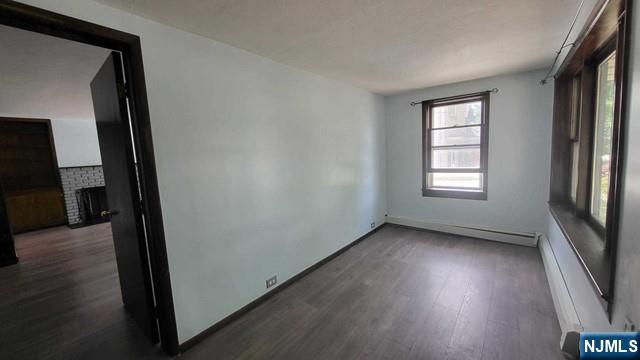 47 Hackensack Avenue Ridgefield Park, NJ 07660 - Photo 4 of 36 an empty room with wooden floor and windows
