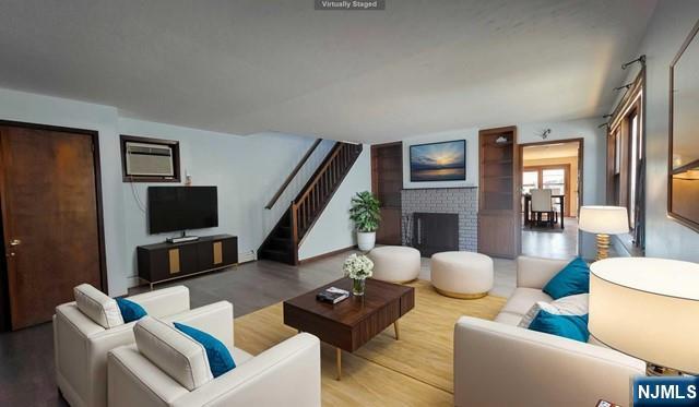 47 Hackensack Avenue Ridgefield Park, NJ 07660 - Photo 5 of 36 a living room with furniture and a flat screen tv