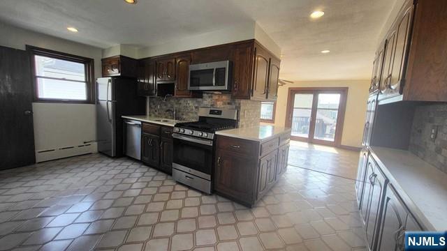 47 Hackensack Avenue Ridgefield Park, NJ 07660 - Photo 9 of 36 a kitchen with stainless steel appliances granite countertop a stove a sink and a refrigerator