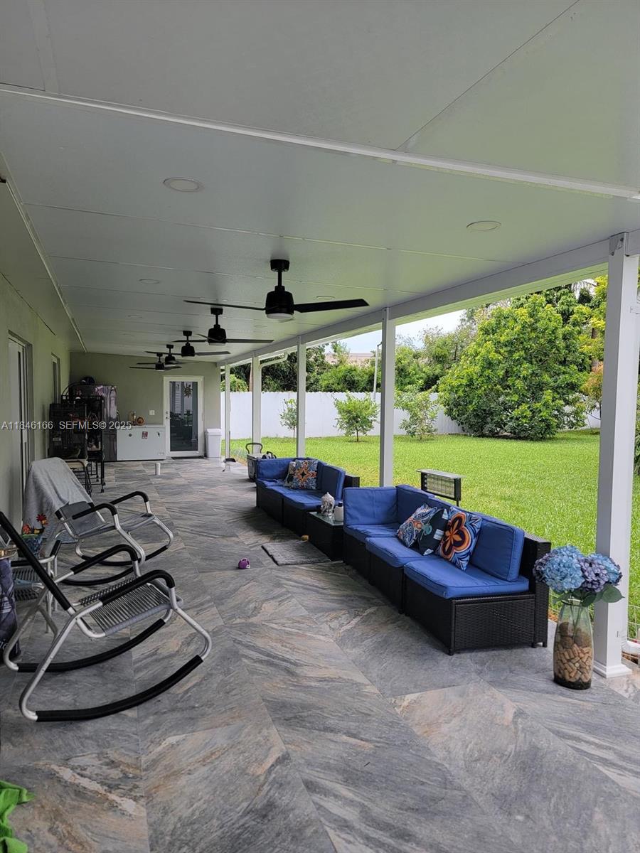 30730 Southwest 156th Avenue Homestead, FL 33033 - Photo 15 of 24 a room with furniture and a floor to ceiling window