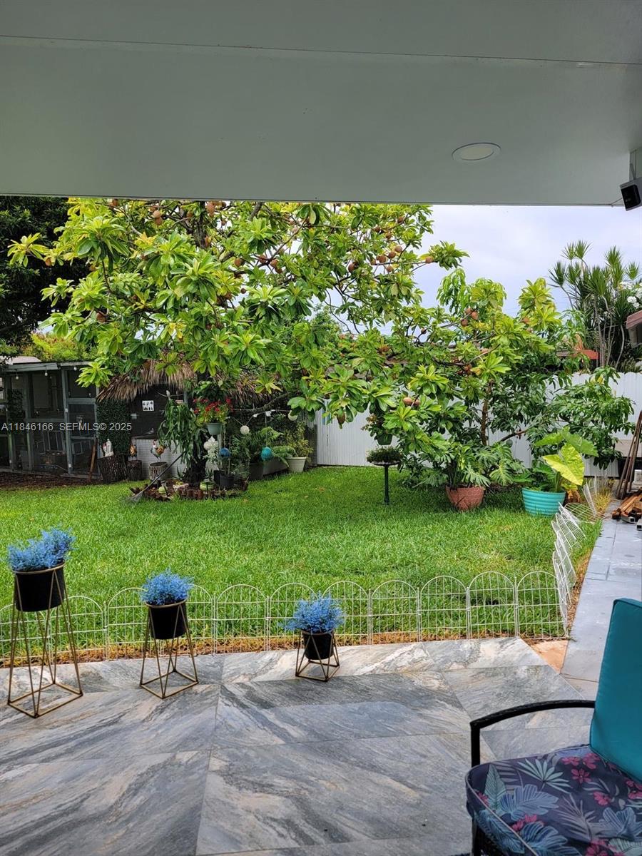 30730 Southwest 156th Avenue Homestead, FL 33033 - Photo 17 of 24 a view of a garden with an outdoor seating