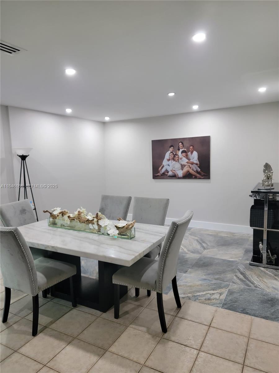 30730 Southwest 156th Avenue Homestead, FL 33033 - Photo 19 of 24 a view of a dining room with furniture