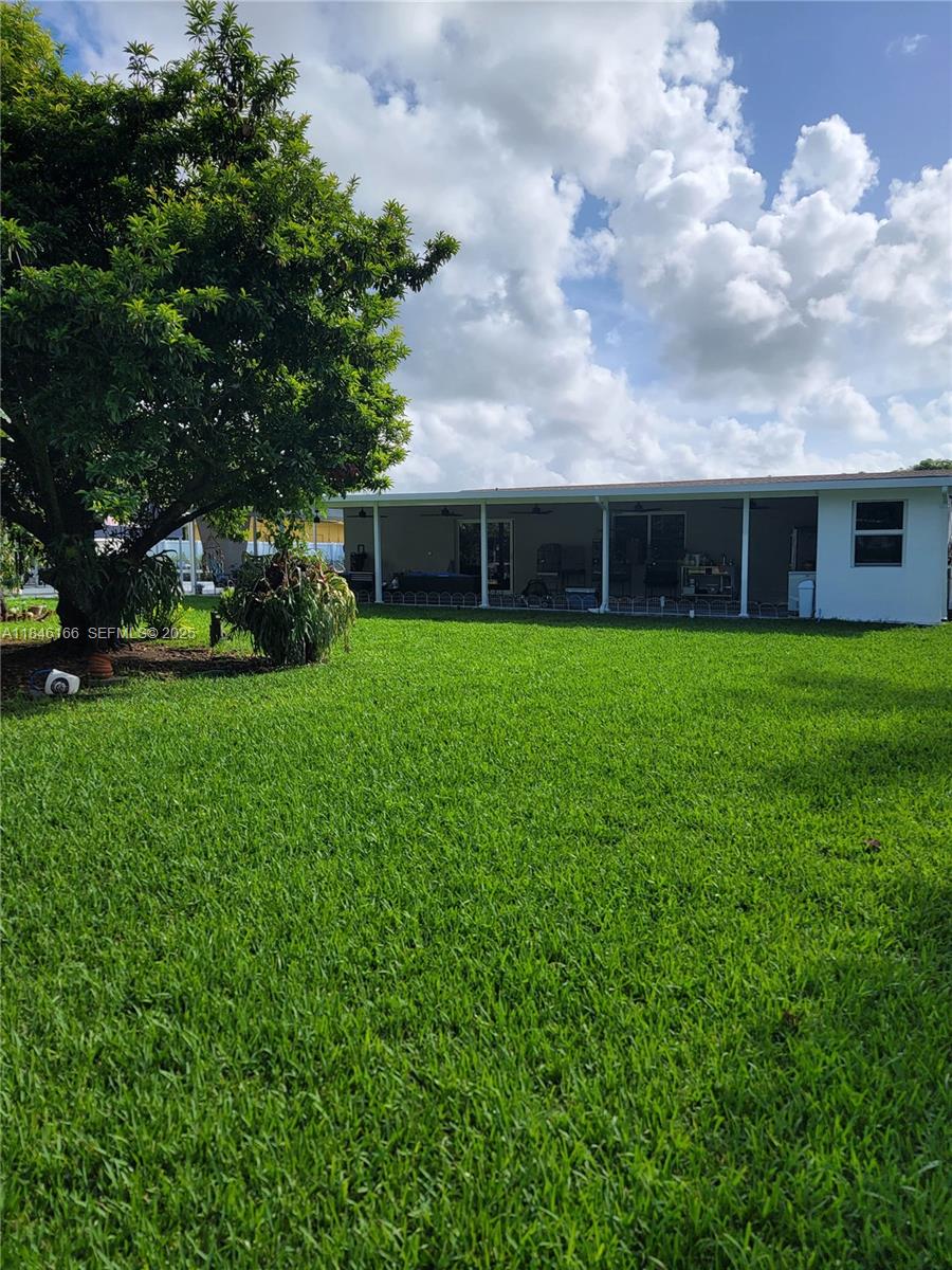 30730 Southwest 156th Avenue Homestead, FL 33033 - Photo 23 of 24 a view of a backyard of the house
