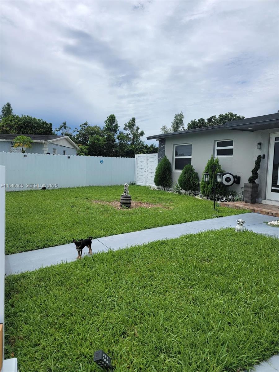 30730 Southwest 156th Avenue Homestead, FL 33033 - Photo 4 of 24 a view of a garden with houses