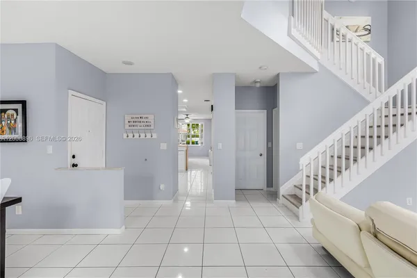 a kitchen with a sink window and cabinets