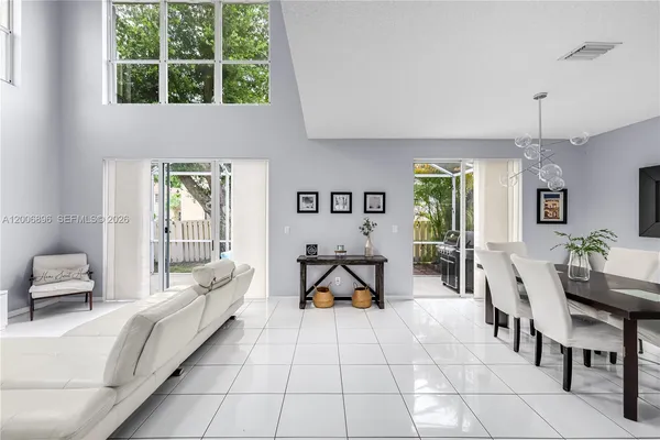 a kitchen with white cabinets appliances and a sink