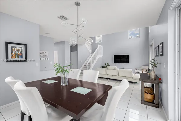 a kitchen with stainless steel appliances a refrigerator and a stove top oven