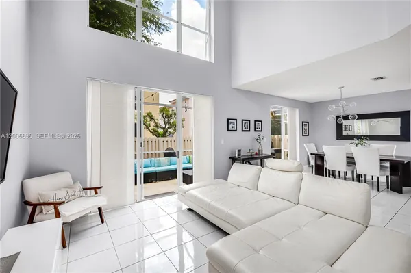 a kitchen with stainless steel appliances kitchen island granite countertop a refrigerator and a stove top oven