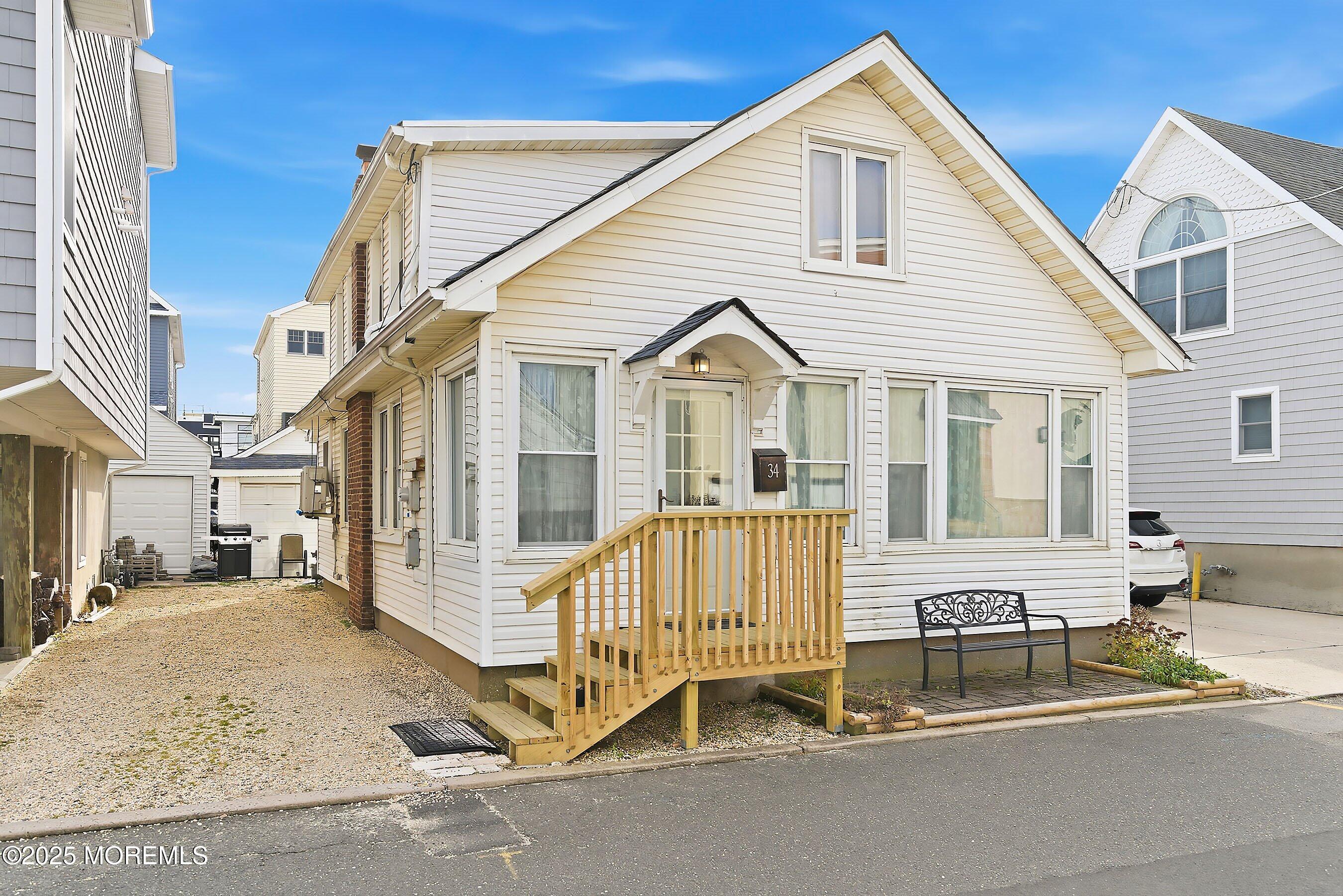 34 Waterview Way Sea Bright, NJ 07760 - Photo 1 of 24 a view of a house with wooden fence