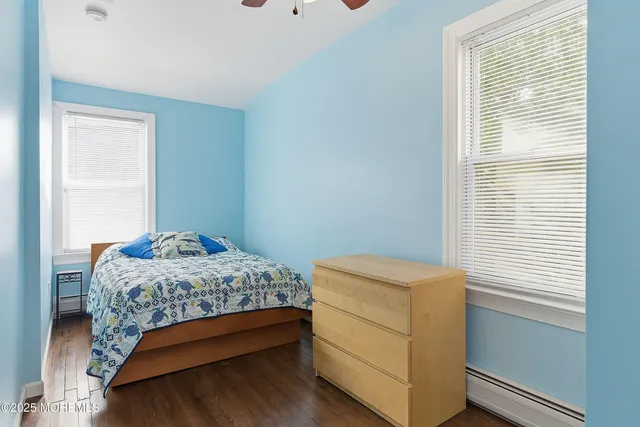 a room that has a bed and a window in it