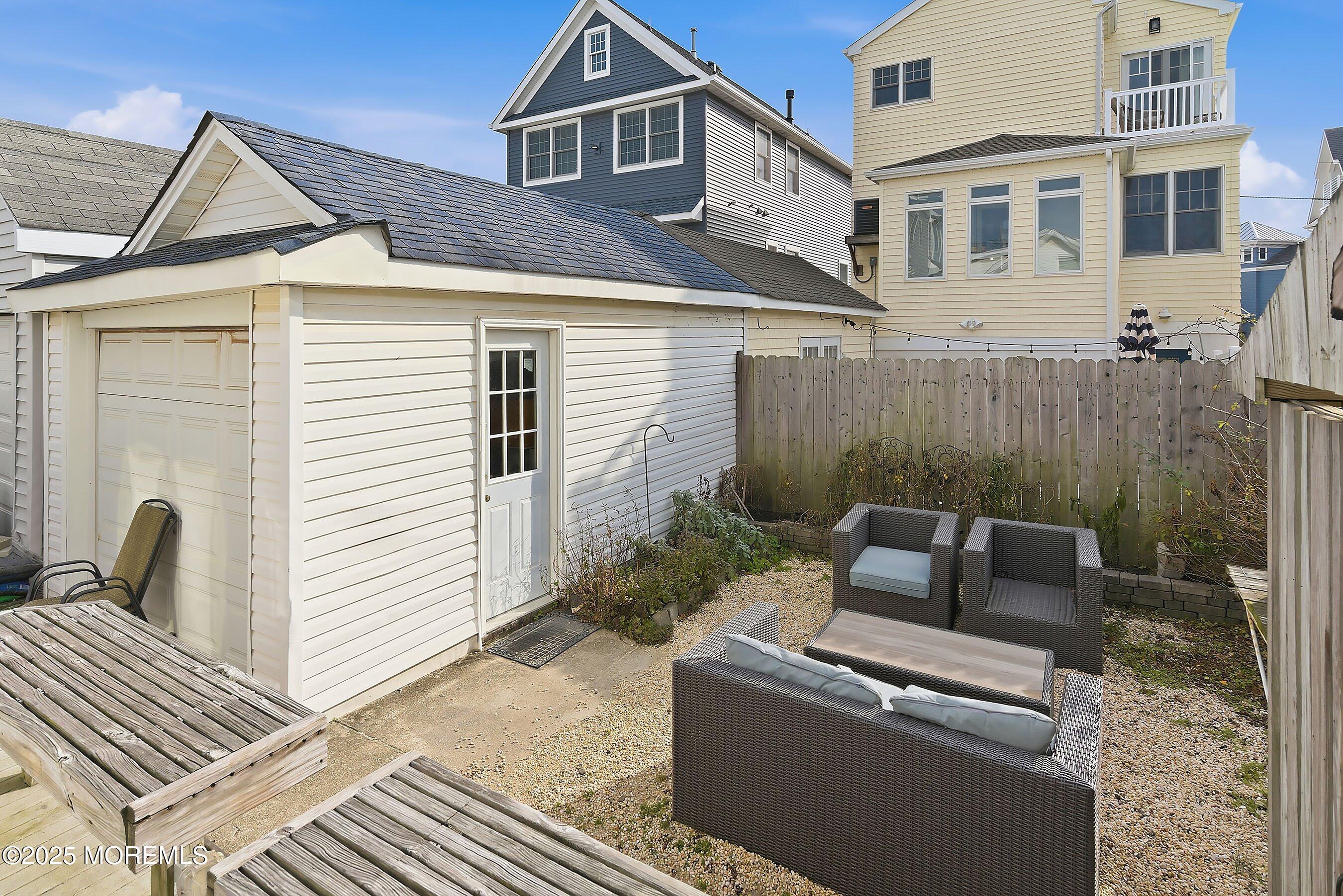 34 Waterview Way Sea Bright, NJ 07760 - Photo 22 of 24 a wooden bench sitting in front of a house