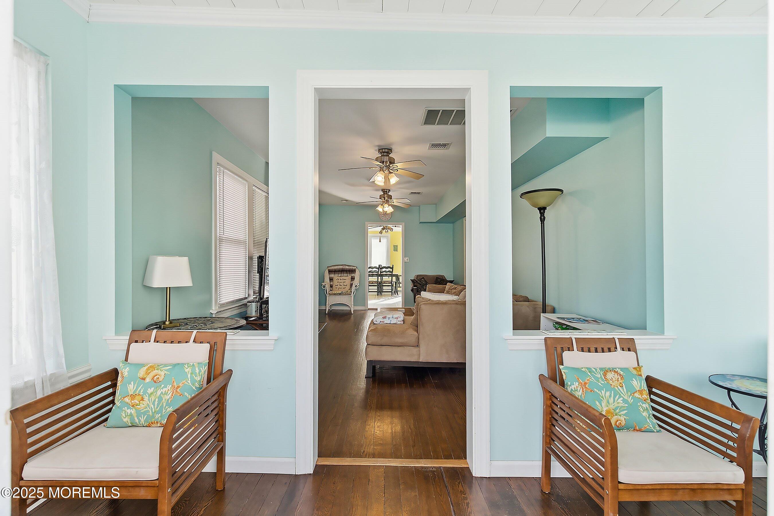 34 Waterview Way Sea Bright, NJ 07760 - Photo 3 of 24 a view of a hallway with furniture and wooden floor