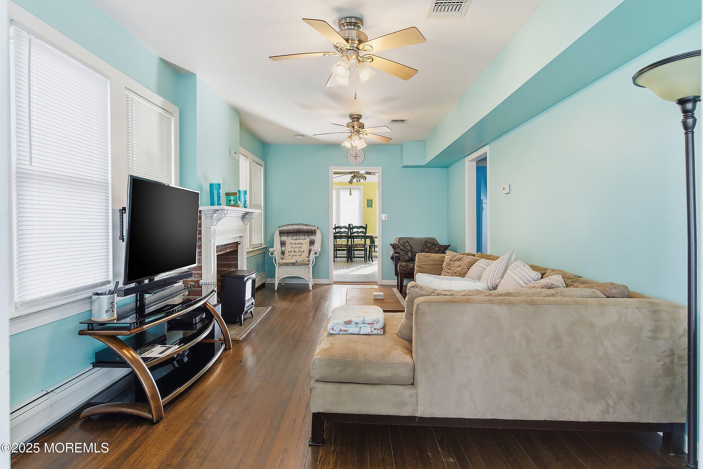 34 Waterview Way Sea Bright, NJ 07760 - Photo 9 of 24 a living room with furniture and a flat screen tv